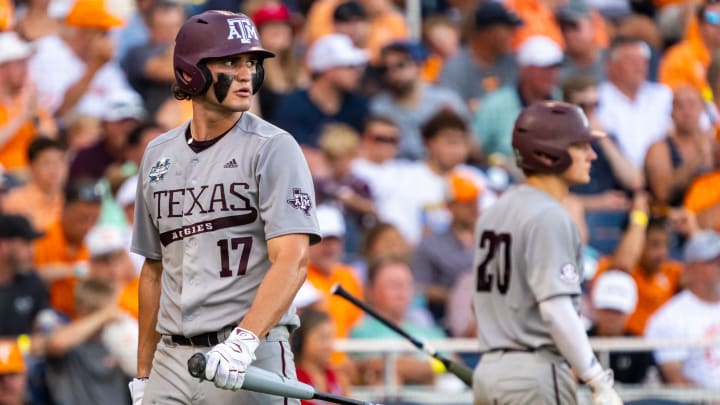 Jun 24, 2024; Omaha, NE, USA; Texas A&M Aggies right fielder Jace Laviolette (17) walks off as catcher Jackson Appel (20) walks up to bat during the sixth inning against the Tennessee Volunteers at Charles Schwab Field Omaha. 