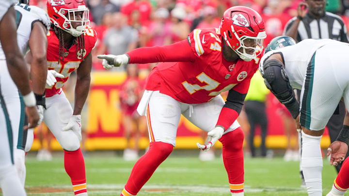 Sep 14, 2025; Kansas City, Missouri, USA; Kansas City Chiefs offensive tackle Jawaan Taylor (74) gestures at the line of scrimmage against the Philadelphia Eagles during the game at GEHA Field at Arrowhead Stadium. Mandatory Credit: Denny Medley-Imagn Images
