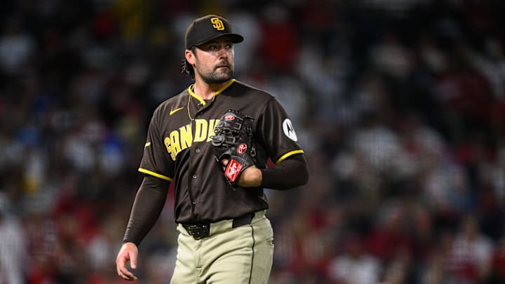 Matt Waldron (61) looks on after a pitching change during the fourth inning against the Los Angeles Angels at Angel Stadium. 