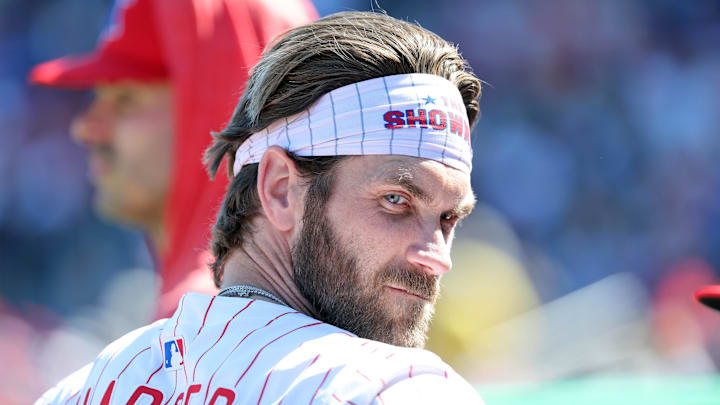 Philadelphia Phillies first base Bryce Harper (3) looks on in the dugout against the Boston Red Sox at BayCare Ballpark