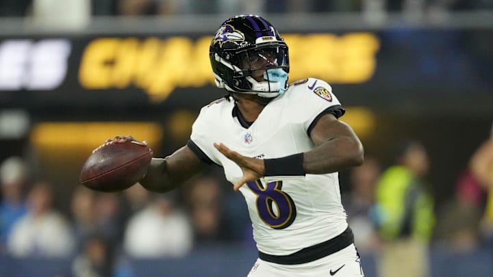 Baltimore Ravens quarterback Lamar Jackson (8) throws the ball against the Los Angeles Chargers in the first half at SoFi Stadium. 