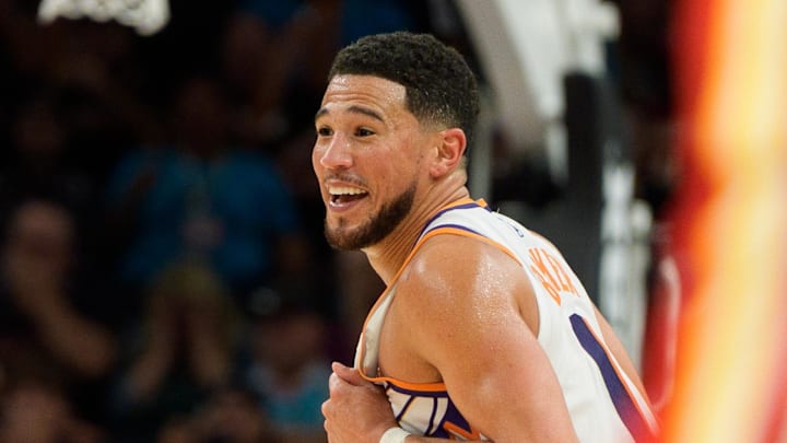 Nov 16, 2025; Phoenix, Arizona, USA; Phoenix Suns guard Devin Booker (1) reacts and smiles during the second half of play against the Atlanta Hawks at Mortgage Matchup Center. Mandatory Credit: Allan Henry-Imagn Images