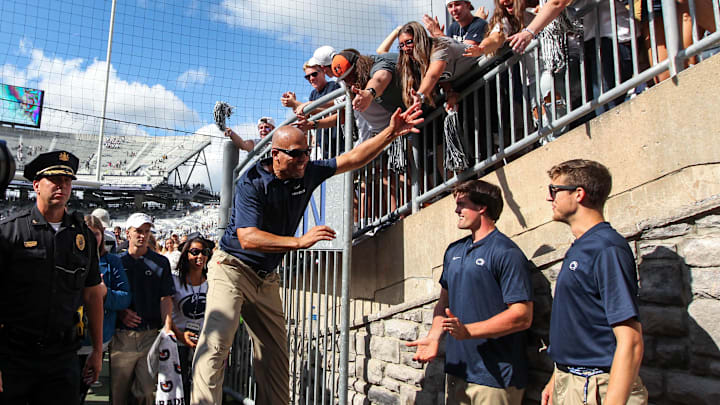 Penn State football coach James Franklin celebrates with the students following a Nittany Lions game at Beaver Stadium. 
