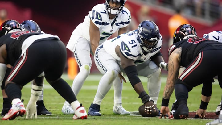 Seattle Seahawks center Olu Oluwatimi (51) prepares to snap the ball to quarterback Geno Smith (7).
