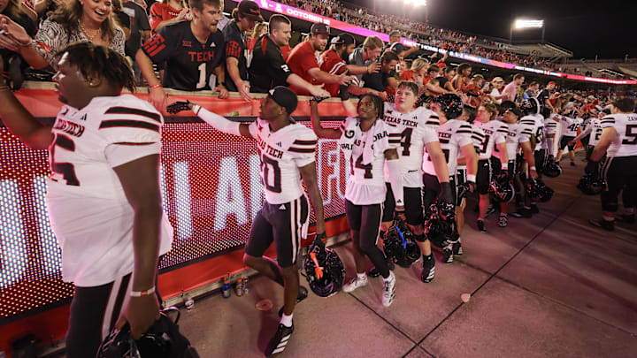 Texas Tech celebrates with fans after defeating Houston 35-11. Texas Tech celebrates with fans after defeating Houston 35-11.