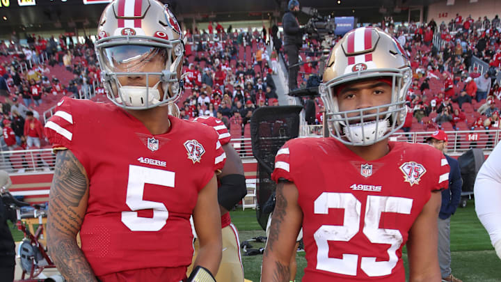 San Francisco 49ers quarterback Trey Lance (L) and running back Elijah Mitchell (R)