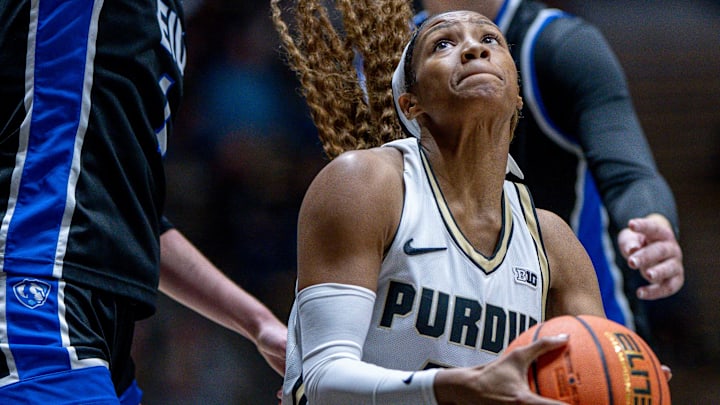 Purdue redshirt junior Tara Daye (44) drives the lane.