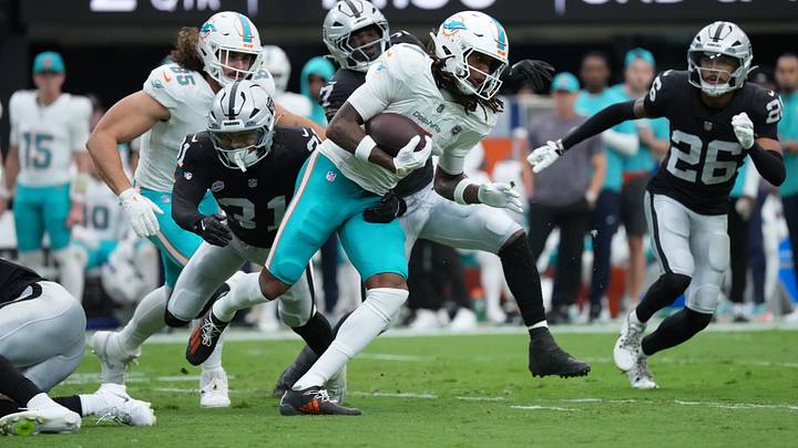 Sep 13, 2026; Paradise, Nevada, USA;  Miami Dolphins wide receiver Caleb Douglas (7) runs with the ball in the second quarter against the Las Vegas Raiders at Allegiant Stadium.  Mandatory Credit: Kirby Lee-Imagn Images