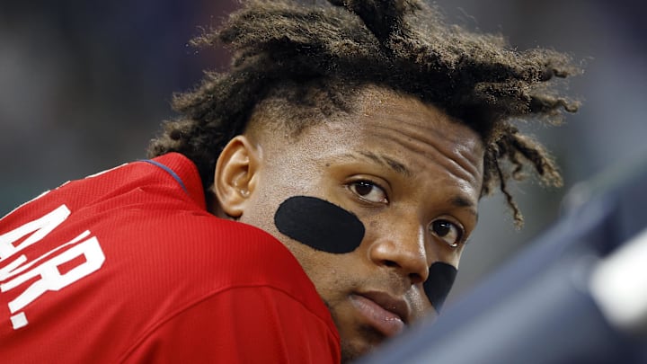 Jun 22, 2025; Miami, Florida, USA;  Atlanta Braves right fielder Ronald Acuna Jr. (13) leans agains the dugout rail against the Miami during the sixth inning at loanDepot Park. Mandatory Credit: Rhona Wise-Imagn Images