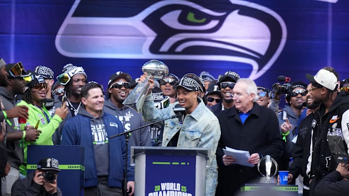 Feb 11, 2026; Seattle, WA, USA; Seattle Seahawks wide receiver Jaxon Smith-Njigba (11) holds the Vince Lombardi trophy during the Super Bowl LX trophy celebration at Lumen Field. Mandatory Credit: Kirby Lee-Imagn Images