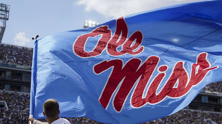 Sep 17, 2022; Atlanta, Georgia, USA; Mississippi Rebels cheerleader waves a flag after a touchdown against the Georgia Tech Yellow Jackets in the first quarter at Bobby Dodd Stadium. Mandatory Credit: Brett Davis-USA TODAY Sports
