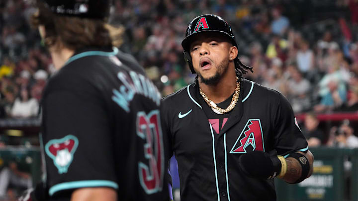 Jun 30, 2024; Phoenix, Arizona, USA; Arizona Diamondbacks second base Ketel Marte (4) celebrates with Arizona Diamondbacks outfielder Jake McCarthy (31) after scoring a run against the Oakland Athletics during the fourth inning at Chase Field. Mandatory Credit: Joe Camporeale-USA TODAY Sports