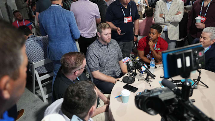 Mar 31, 2025; Palm Beach, FL, USA;  Jacksonville Jaguars head coach Liam Coen, center,  attends the NFL Annual League Meeting at The Breakers. Mandatory Credit: Jim Rassol-Imagn Images
