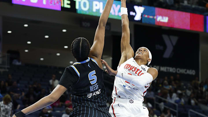 Jun 17, 2025; Chicago, Illinois, USA; Washington Mystics guard Brittney Sykes (20) shoots against Chicago Sky forward Angel Reese (5) during the second half of a WNBA game at Wintrust Arena. Mandatory Credit: Kamil Krzaczynski-Imagn Images