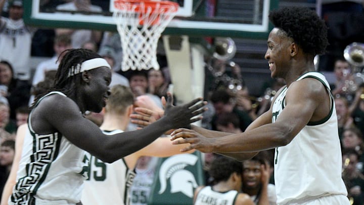 Feb 7, 2026; East Lansing, Michigan, USA;  Michigan State Spartans forward Cameron Ward (3) and Michigan State Spartans guard Kur Teng (2) celebrate in overtime against the Illinois Fighting Illini at Jack Breslin Student Events Center. Mandatory Credit: Dale Young-Imagn Images