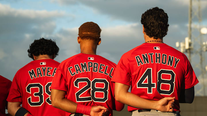 Boston's top-three prospects in Marcelo Mayer, Kristian Campbell and Roman Anthony stand for the national anthem ahead of a Spring Training breakout game on March 13, 2025.