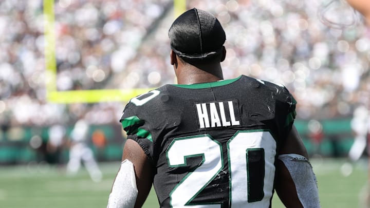Oct 5, 2025; East Rutherford, New Jersey, USA; New York Jets running back Breece Hall (20) looks on from the sidelines after fumbling during the first half against the Dallas Cowboys at MetLife Stadium. 