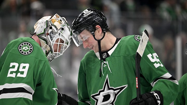 Jan 31, 2025; Dallas, Texas, USA; Dallas Stars goaltender Jake Oettinger (29) and defenseman Thomas Harley (55) celebrate on the ice after the Stars defeat the Vancouver Canucks at the American Airlines Center. Mandatory Credit: Jerome Miron-Imagn Images