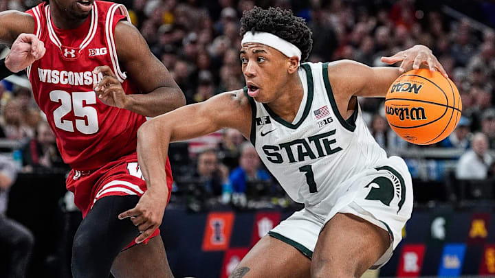 Michigan State guard Jeremy Fears Jr. (1) dribbles against Wisconsin guard John Blackwell (25) during the second half of Big Ten Tournament semifinal at Gainbridge Fieldhouse in Indianapolis, Ind. on Saturday, March 15, 2025. Michigan State guard Jeremy Fears Jr. (1) dribbles against Wisconsin guard John Blackwell (25) during the second half of Big Ten Tournament semifinal at Gainbridge Fieldhouse in Indianapolis, Ind. on Saturday, March 15, 2025.