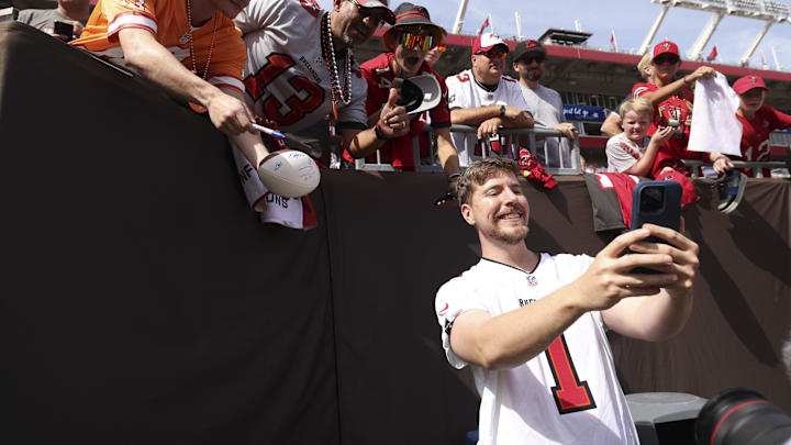 Oct 22, 2023; Tampa, Florida, USA;  YouTuber Jimmy Donaldson MrBeast takes photos with fans before a game between the Atlanta Falcons and Tampa Bay Buccaneers at Raymond James Stadium. Mandatory Credit: Nathan Ray Seebeck-Imagn Images