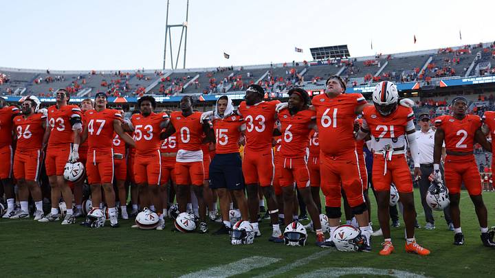 Aug 29, 2026; Charlottesville, Virginia, USA; Virginia Cavaliers celebrate with fans following the game against the North Carolina State Wolfpack at Scott Stadium. Mandatory Credit: Greg Atkins-Imagn Images Aug 29, 2026; Charlottesville, Virginia, USA; Virginia Cavaliers celebrate with fans following the game against the North Carolina State Wolfpack at Scott Stadium. Mandatory Credit: Greg Atkins-Imagn Images