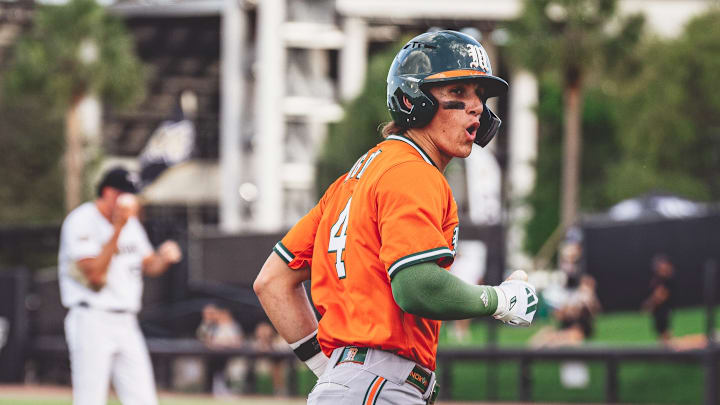 Miami Hurricanes second baseman Jake Ogden ( No. 4) after a home run in the first inning against UCF.