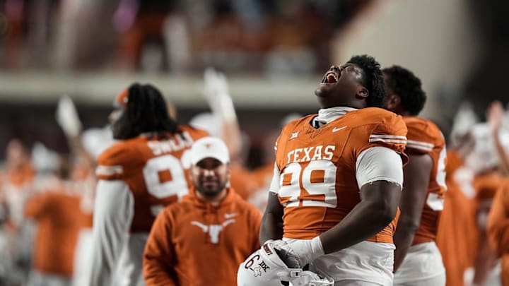 Texas Longhorns defensive lineman Sydir Mitchell (99) cheers after winning the game against Texas Tech at Darrell K Royal Texas Memorial Stadium on Friday, Nov. 24, 2023.