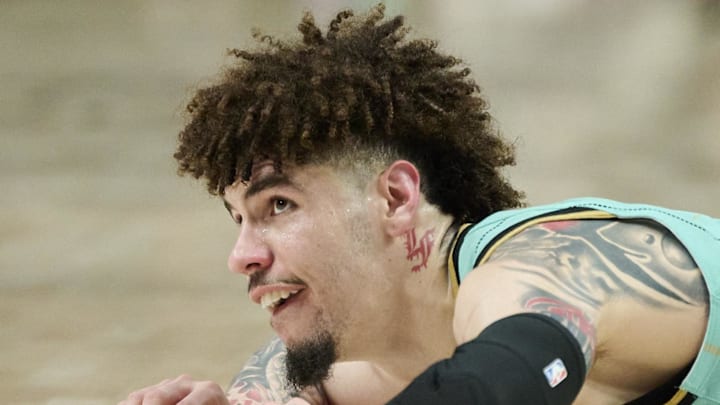Charlotte Hornets guard LaMelo Ball lays on the court after being fouled. Charlotte Hornets guard LaMelo Ball lays on the court after being fouled.