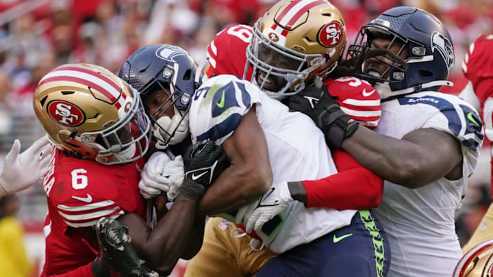 Nov 17, 2024; Santa Clara, California, USA; San Francisco 49ers safety Malik Mustapha (6) and San Francisco 49ers defensive tackle Maliek Collins (99) tackle Seattle Seahawks running back Kenneth Walker III (9) with Seattle Seahawks offensive tackle Charles Cross (67) in on the play during the fourth quarter at Levi's Stadium.