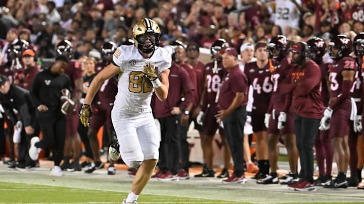 Sep 6, 2025; Blacksburg, Virginia, USA;  Vanderbilt Commodores tight end Brycen Coleman (82) runs for a touchdown after catching a pass during the second quarter at Lane Stadium. Mandatory Credit: Brian Bishop-Imagn Images