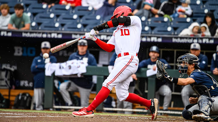 Hogan Helligso hits a single to score Carey and Sanderson. 