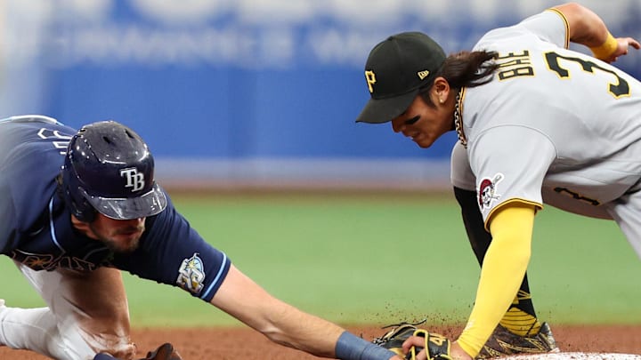 May 4, 2023; St. Petersburg, Florida, USA;  Tampa Bay Rays designated hitter Josh Lowe (15) is caught stealing by Pittsburgh Pirates second baseman Ji Hwan Bae (3) in the sixth inning at Tropicana Field.