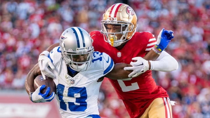 October 8, 2023; Santa Clara, California, USA; San Francisco 49ers cornerback Deommodore Lenoir (2) tackles Dallas Cowboys wide receiver Michael Gallup (13) during the second quarter at Levi's Stadium. Mandatory Credit: Kyle Terada-USA TODAY Sports October 8, 2023; Santa Clara, California, USA; San Francisco 49ers cornerback Deommodore Lenoir (2) tackles Dallas Cowboys wide receiver Michael Gallup (13) during the second quarter at Levi's Stadium. Mandatory Credit: Kyle Terada-USA TODAY Sports