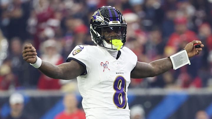Dec 25, 2024; Houston, Texas, USA;  Baltimore Ravens quarterback Lamar Jackson (8) reacts under center against the Houston Texans in the first quarter at NRG Stadium.
