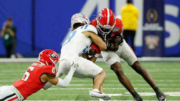 Jan 1, 2026; New Orleans, LA, USA; Georgia Bulldogs defensive back Daylen Everette (6) and defensive back Jacorey Thomas (20) tackle Mississippi Rebels wide receiver Cayden Lee (19) in the second quarter during the 2026 Sugar Bowl and quarterfinal game of the College Football Playoff at Caesars Superdome. Thomas was called for a penalty on the play. Mandatory Credit: Geoff Burke-Imagn Images Jan 1, 2026; New Orleans, LA, USA; Georgia Bulldogs defensive back Daylen Everette (6) and defensive back Jacorey Thomas (20) tackle Mississippi Rebels wide receiver Cayden Lee (19) in the second quarter during the 2026 Sugar Bowl and quarterfinal game of the College Football Playoff at Caesars Superdome. Thomas was called for a penalty on the play. Mandatory Credit: Geoff Burke-Imagn Images