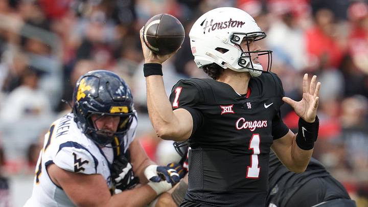 Nov 1, 2025; Houston, Texas, USA; Houston Cougars quarterback Conner Weigman (1) drops back to pass against the West Virginia Mountaineers in the first half at TDECU Stadium. Mandatory Credit: Thomas Shea-Imagn Images