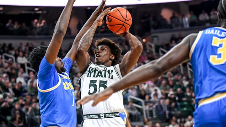 Michigan State's Coen Carr, right, shoots UCLA's Xavier Booker defends during the first half on Tuesday, Feb. 17, 2026, at the Breslin Center in East Lansing.