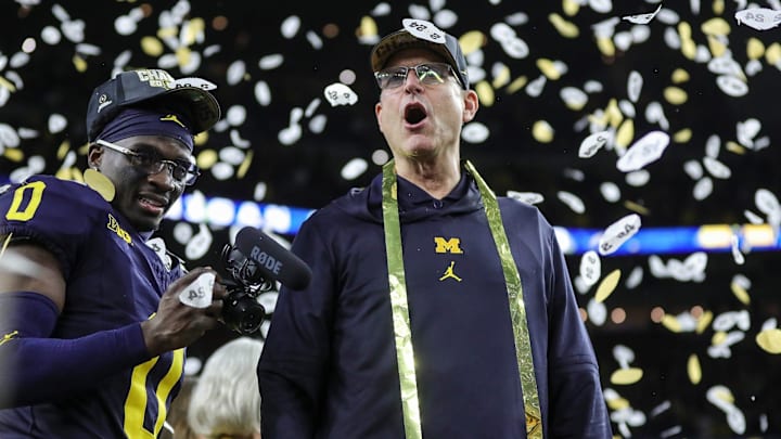 Michigan head coach Jim Harbaugh celebrates during the trophy presentation after the 34-13 win over Washington at the national championship game at NRG Stadium in Houston on Monday, Jan. 8, 2024.