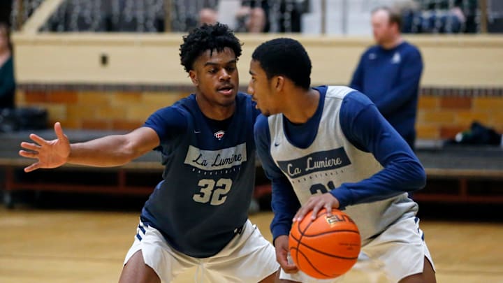 La Lumiere junior Jalen Haralson (32) defends teammate Ace Bucker during an open practice Thursday, Nov. 9, 2023, at the La Porte Civic Auditorium.