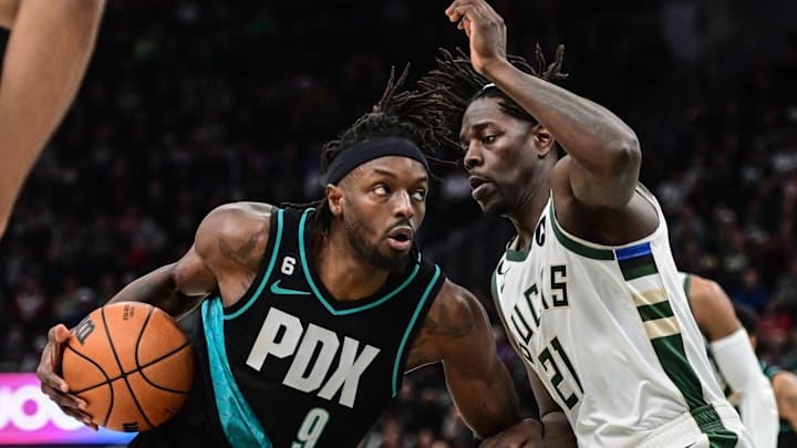 Nov 21, 2022; Milwaukee, Wisconsin, USA; Portland Trail Blazers forward Jerami Grant (9) drives for the basket against Milwaukee Bucks guard Jrue Holiday (21) in the third quarter at Fiserv Forum. Mandatory Credit: Benny Sieu-Imagn Images