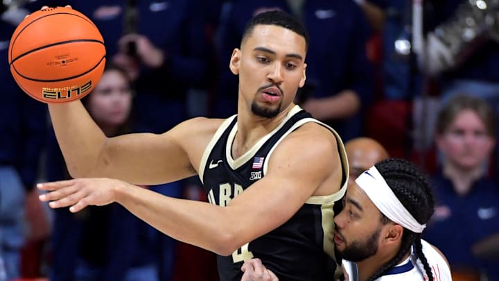 Illinois Fighting Illini guard Kylan Boswell (4) guards Purdue Boilermakers forward Trey Kaufman-Renn (4) 