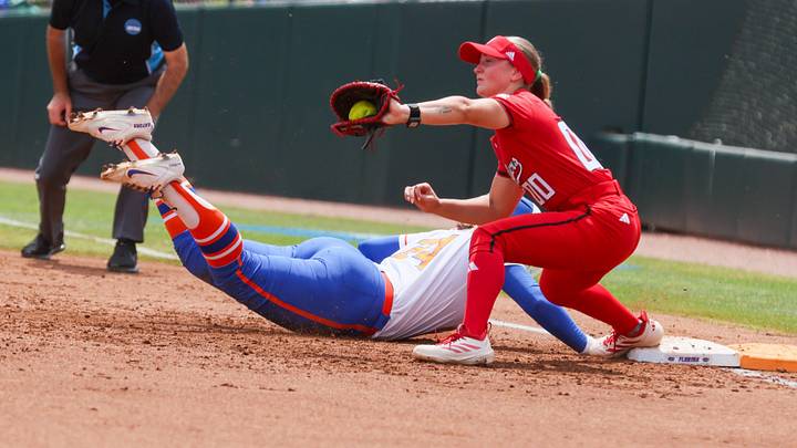 Florida infielder Madison Walker (24) gets back to first under Texas Tech infielder Jackie Lis (00) during the super regional game of the NCAA Division 1 softball championship at Katie Seashole Pressly Stadium in Gainesville, FL on Friday, May 22, 2026. [Alan Youngblood/Gainesville Sun]
