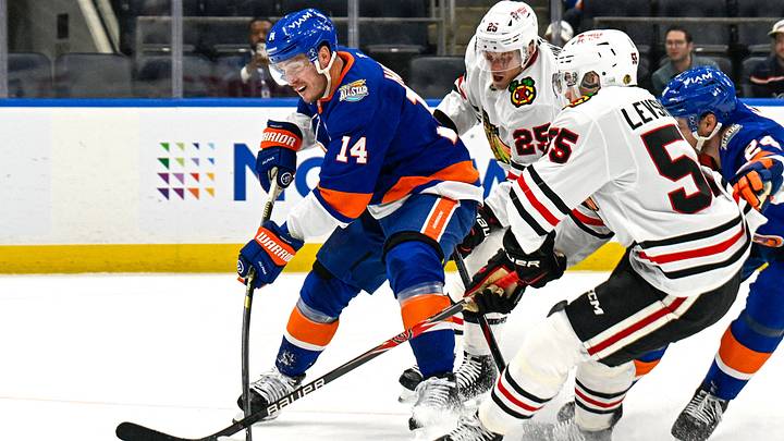 Oct 8, 2026; Elmont, New York, USA; New York Islanders center Bo Horvat (14) attempts a shot defended by Chicago Blackhawks defenseman Artyom Levshunov (55) and Chicago Blackhawks center Dominic Toninato (25) during the second period at UBS Arena. Mandatory Credit: Dennis Schneidler-Imagn Images Oct 8, 2026; Elmont, New York, USA; New York Islanders center Bo Horvat (14) attempts a shot defended by Chicago Blackhawks defenseman Artyom Levshunov (55) and Chicago Blackhawks center Dominic Toninato (25) during the second period at UBS Arena. Mandatory Credit: Dennis Schneidler-Imagn Images