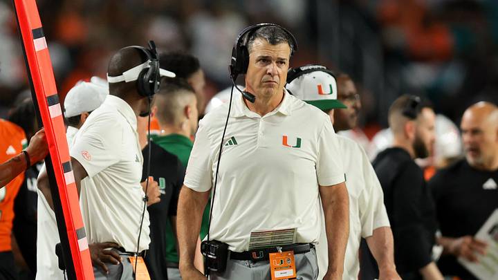 Nov 15, 2025; Miami Gardens, Florida, USA; Miami Hurricanes head coach Mario Cristobal watches from the sideline against NC State Wolfpack during the fourth quarter at Hard Rock Stadium. Mandatory Credit: Sam Navarro-Imagn Images