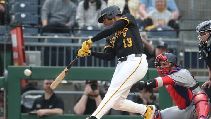 Pittsburgh, Pennsylvania, USA;  Pittsburgh Pirates third baseman Ke'Bryan Hayes (13) hits an RBI single against the Washington Nationals during the first inning at PNC Park.