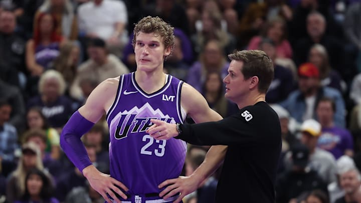 Nov 17, 2023; Salt Lake City, Utah, USA; Utah Jazz forward Lauri Markkanen (23) and head coach Will Hardy speak while the Phoenix Suns shoot free throws in the fourth quarter at Delta Center. Mandatory Credit: Rob Gray-Imagn Images