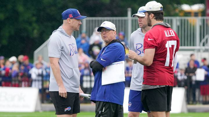 Buffalo Bills' head coach Joe Brady, offensive coordinator Pete Carmichael Jr. (center), quarterback Josh Allen (right), and quarterbacks coach Bo Hardegree talk after practice at Bills' training camp at St. John Fisher University on July 29, 2026 in Pittsford, N.Y. Buffalo Bills' head coach Joe Brady, offensive coordinator Pete Carmichael Jr. (center), quarterback Josh Allen (right), and quarterbacks coach Bo Hardegree talk after practice at Bills' training camp at St. John Fisher University on July 29, 2026 in Pittsford, N.Y.