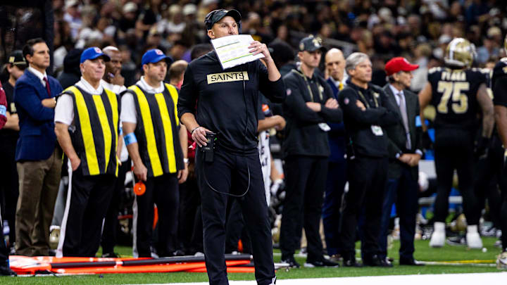 New Orleans Saints head coach Dennis Allen call in a play against the Carolina Panthers