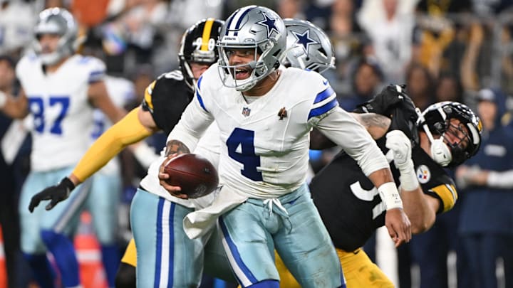 Oct 6, 2024; Pittsburgh, Pennsylvania, USA; Dallas Cowboys quarterback Dak Prescott (4) scrambles against the Pittsburgh Steelers during the first quarter at Acrisure Stadium. Mandatory Credit: Barry Reeger-Imagn Images





