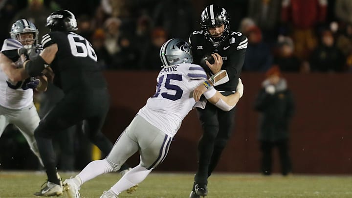 Kansas State Wildcats linebacker Austin Romaine (45) takes down Iowa State Cyclones quarterback Rocco Becht (3) during the third quarter in the NCAA football at Jack Trice Stadium on Saturday, Nov. 30, 2024, in Ames, Iowa.
